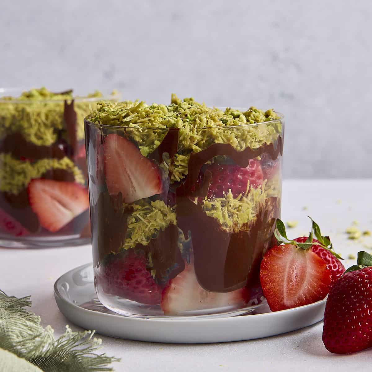 Strawberries in chocolate cup with pistachios